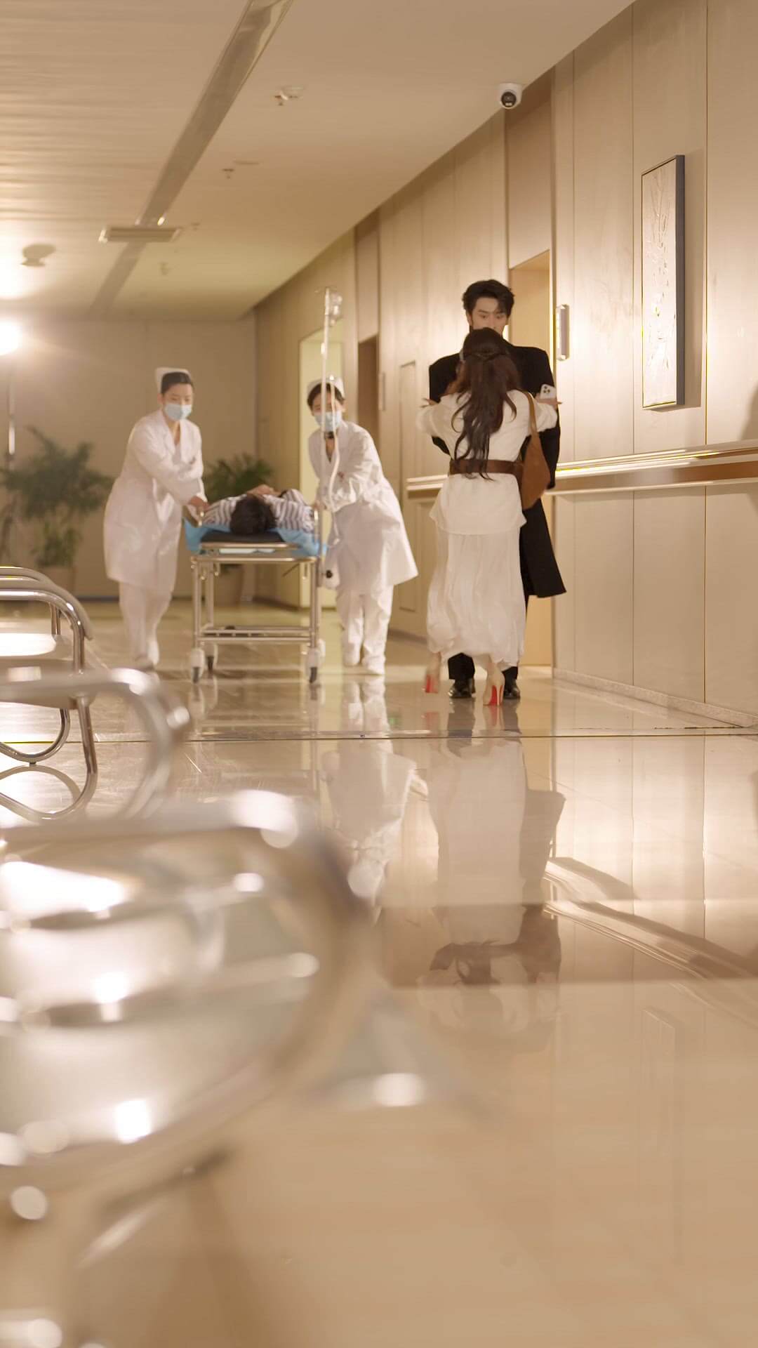 Shen Haonan as Xin Qi and Jin Zixuan as Min Hui in a hospital scene from All My Love For You Chinese micro-drama on Viu