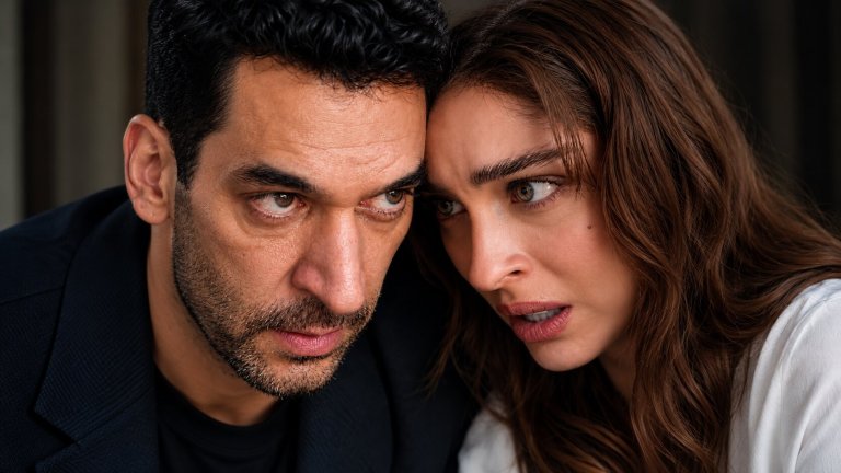 Close-up dramatic shot of Murat Yıldırım as Serhat Tecer and Cemre Baysel as Zeynep Candan in Sins and Roses Season 2 (Güller ve Günahlar).